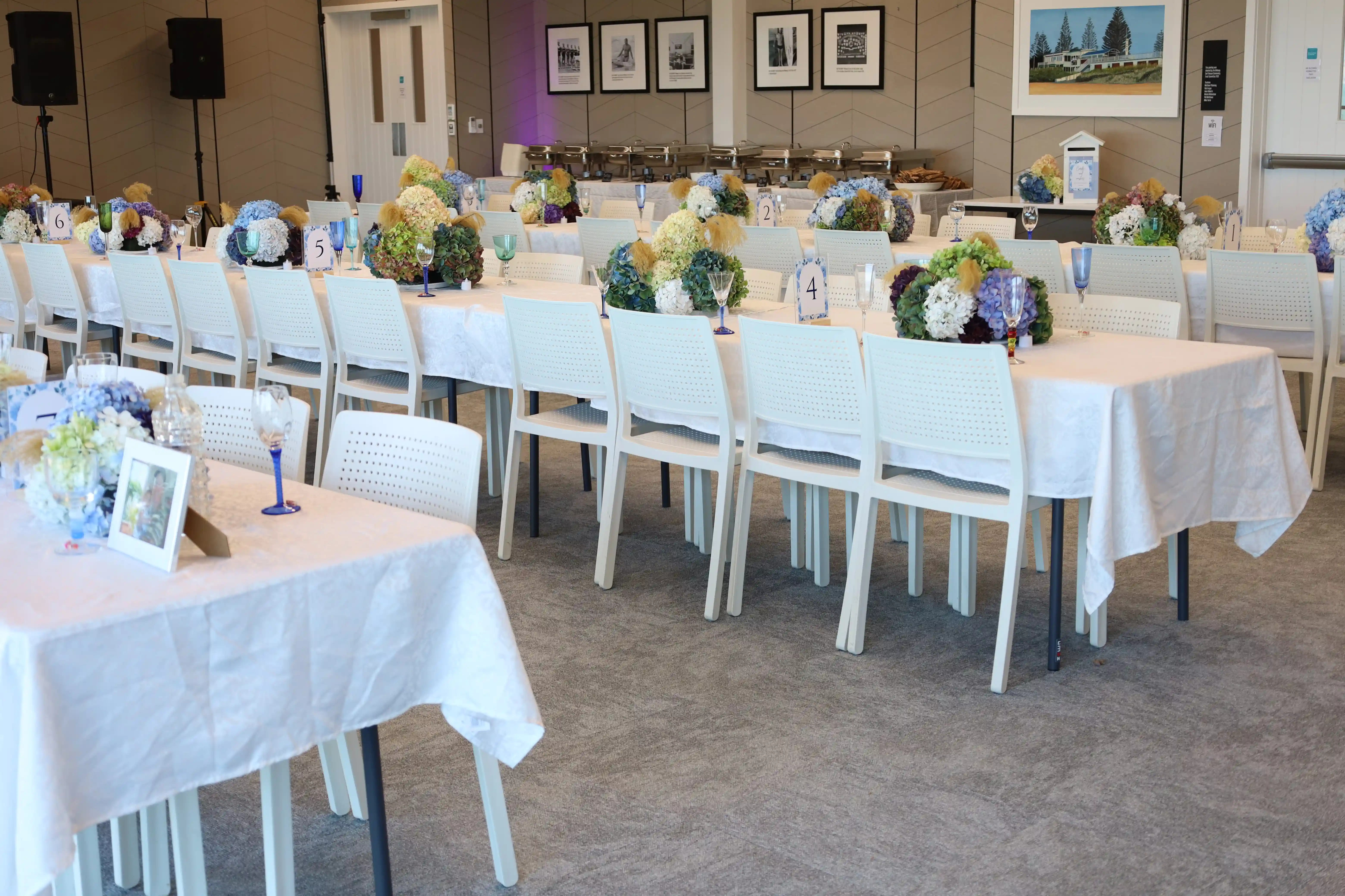 Full view of reception room with hydrangea arrangements at Gisborne beachfront venue