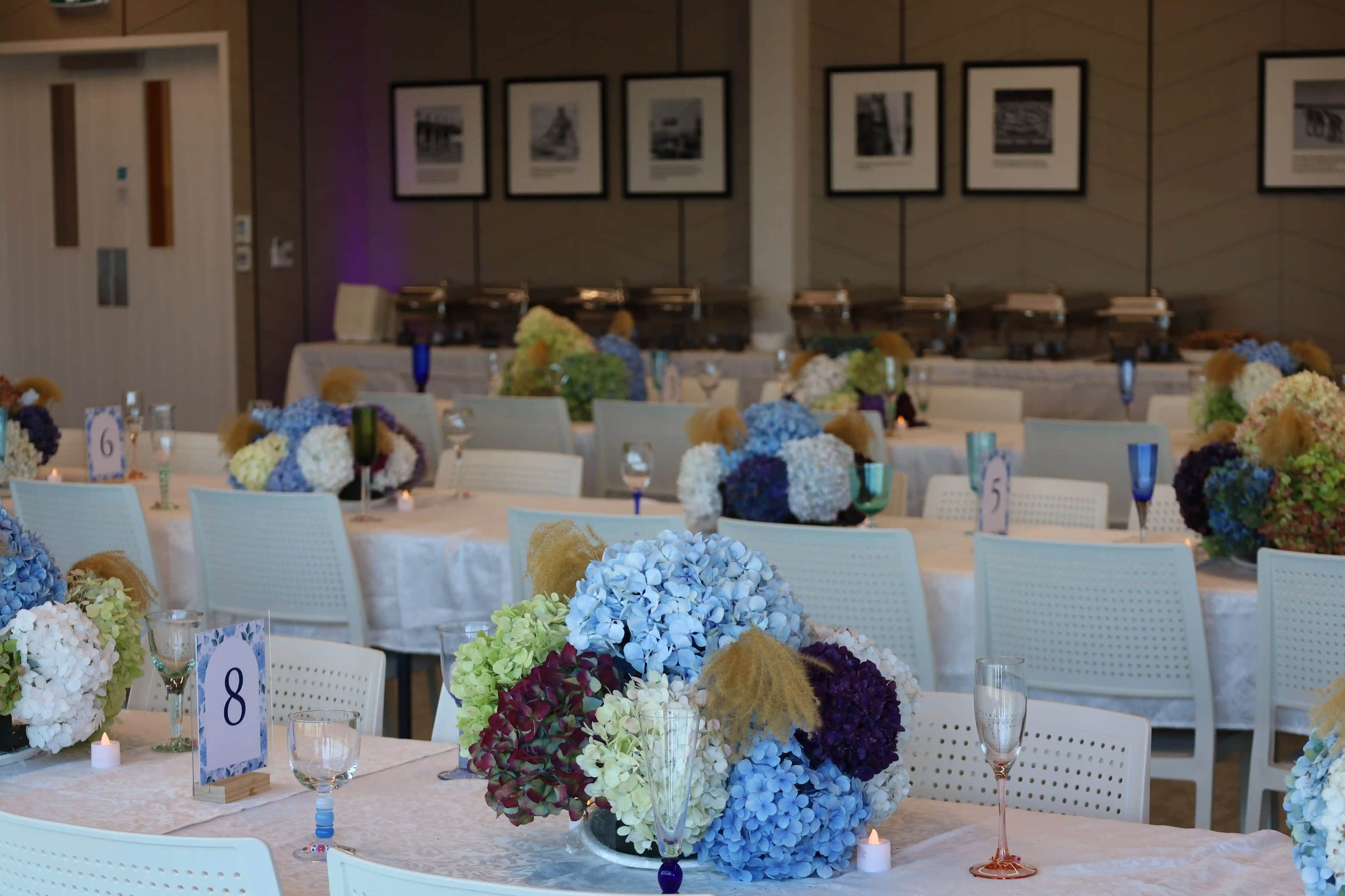 Full reception room with DJ setup at beachfront venue
