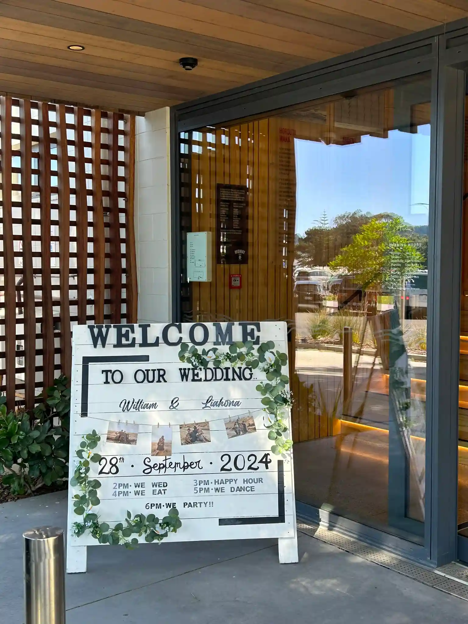 Welcome sign at Gisborne beachfront wedding venue exterior