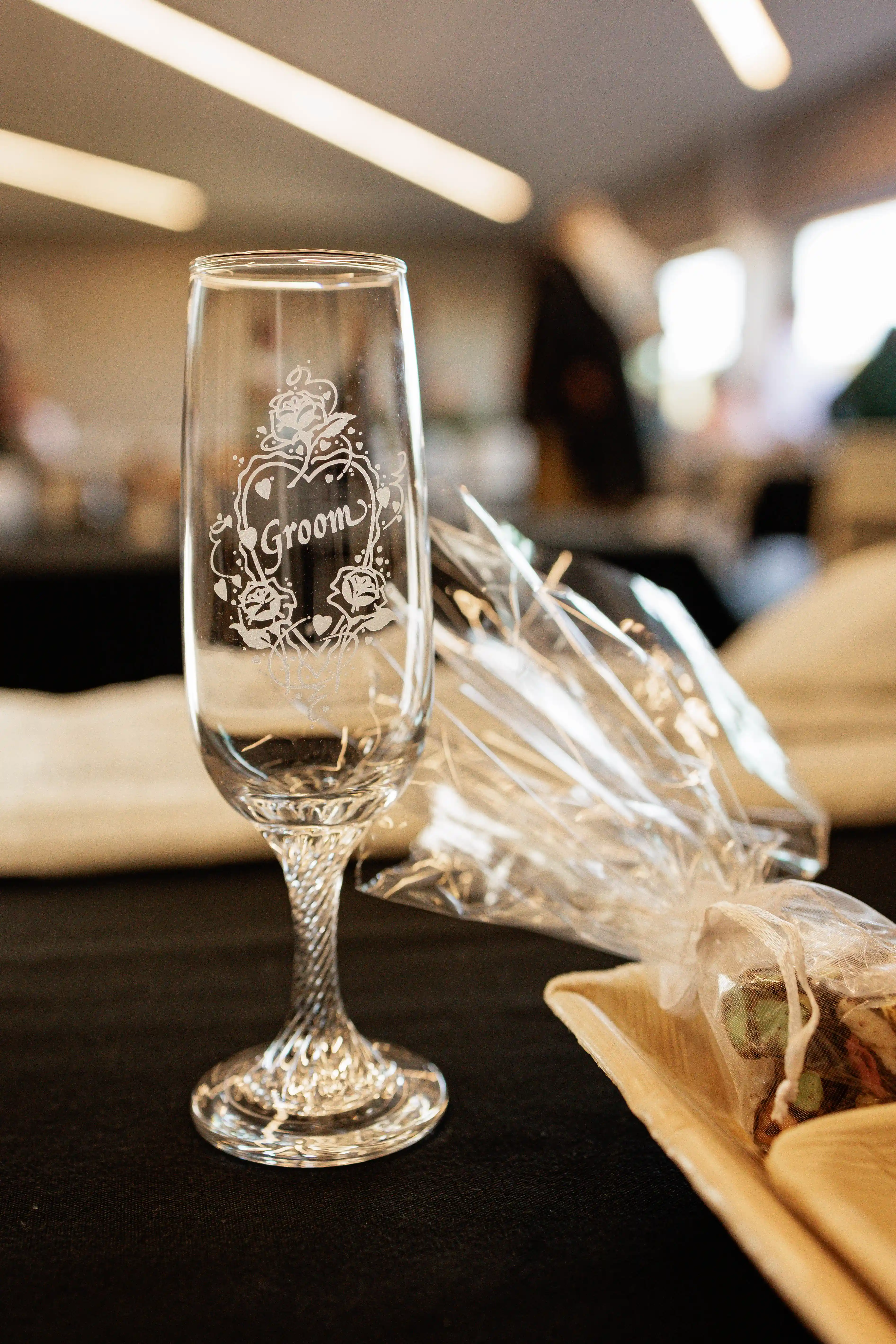 Groom holding champagne flute at Gisborne wedding venue