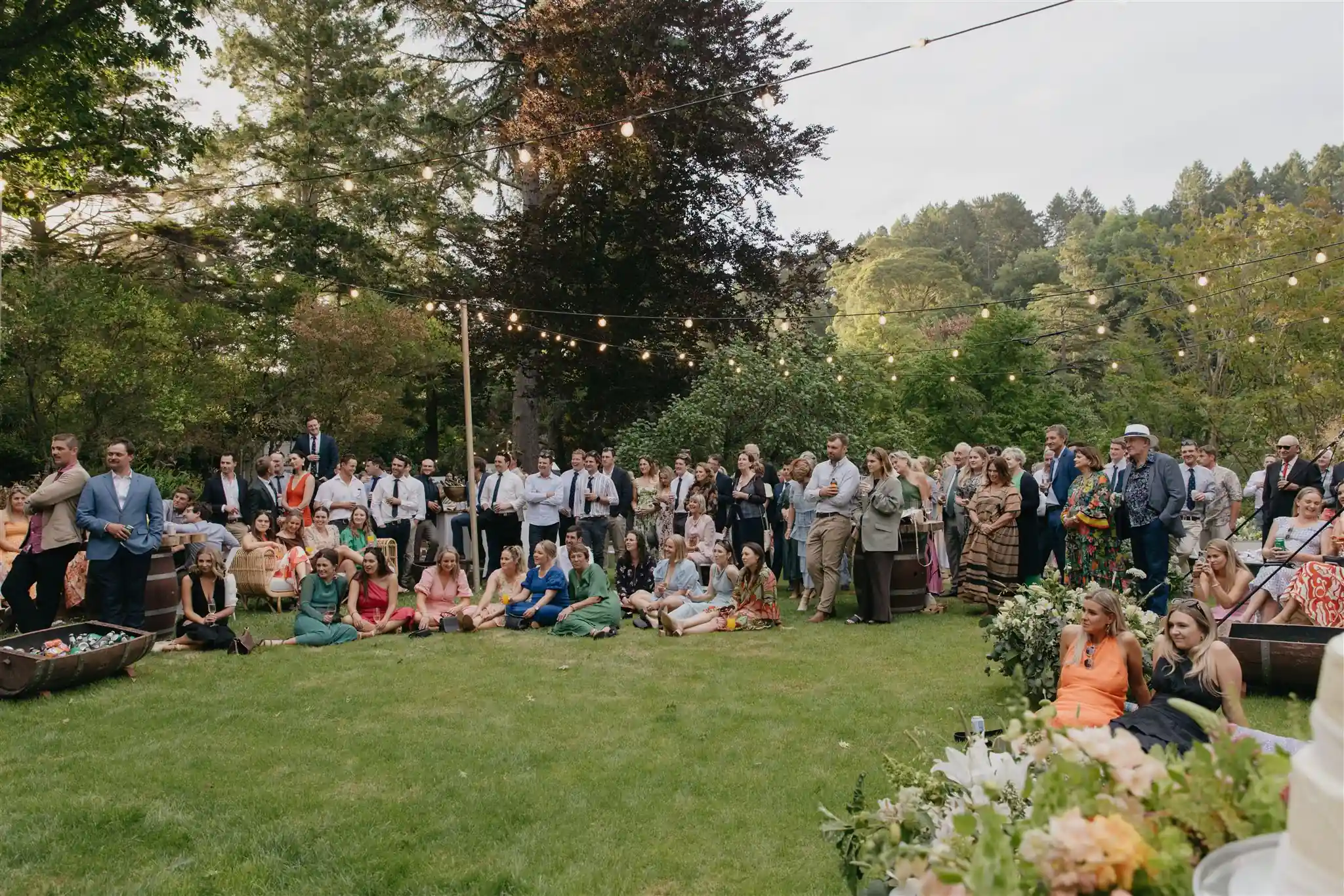 Garden cocktail reception with festoon lights at Gisborne arboretum